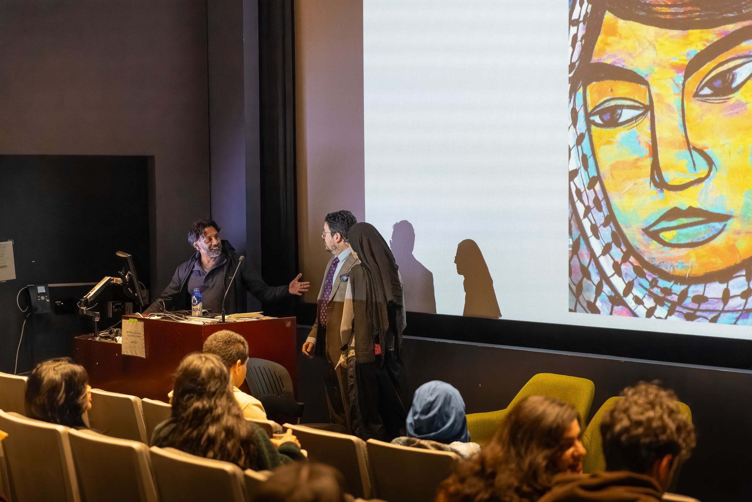 A student being introduced on stage.