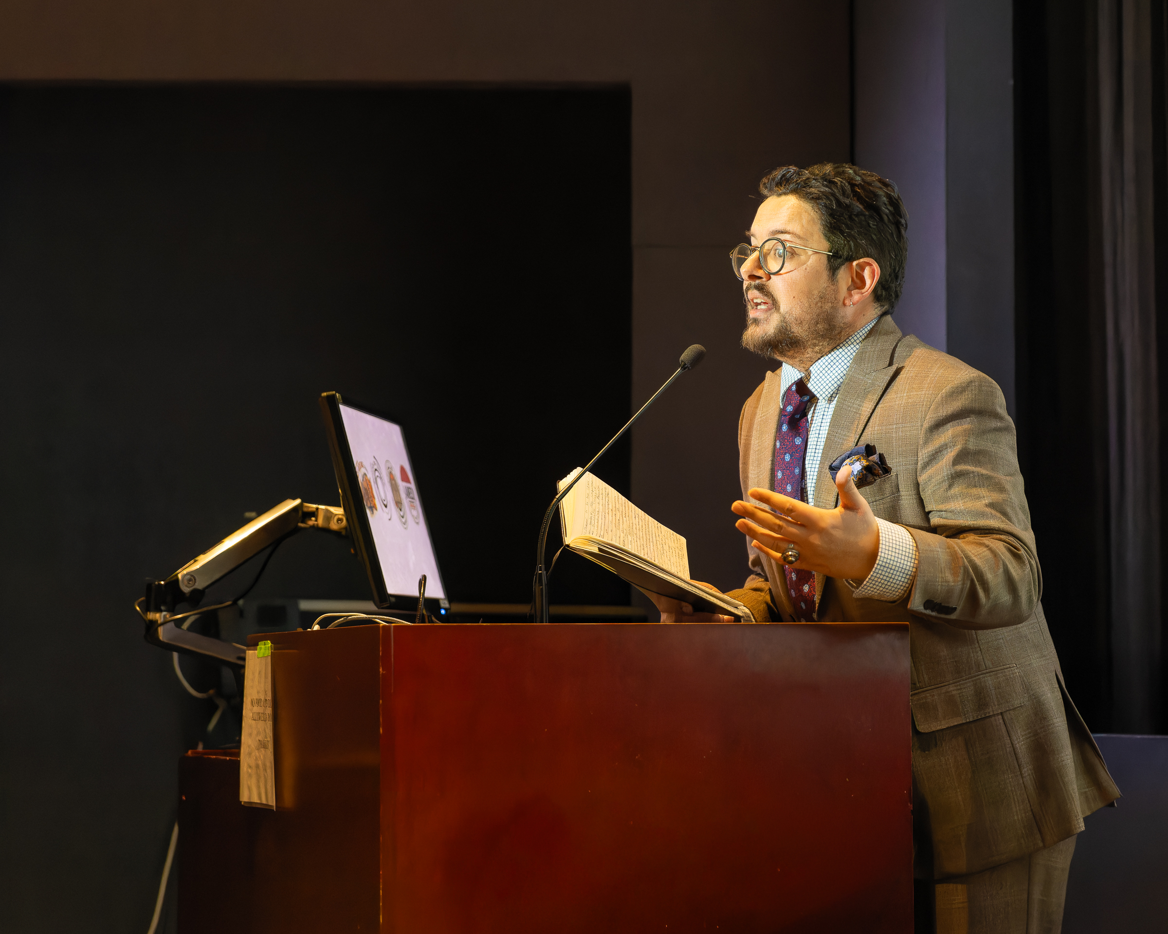 Dr. Zahzah reading an excerpt from his book.