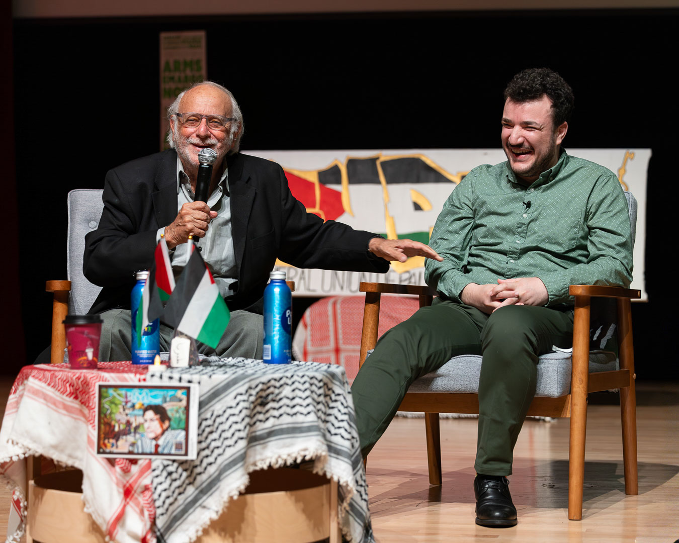 Mark Van Der Hout and Mahmoud Khalil laughing