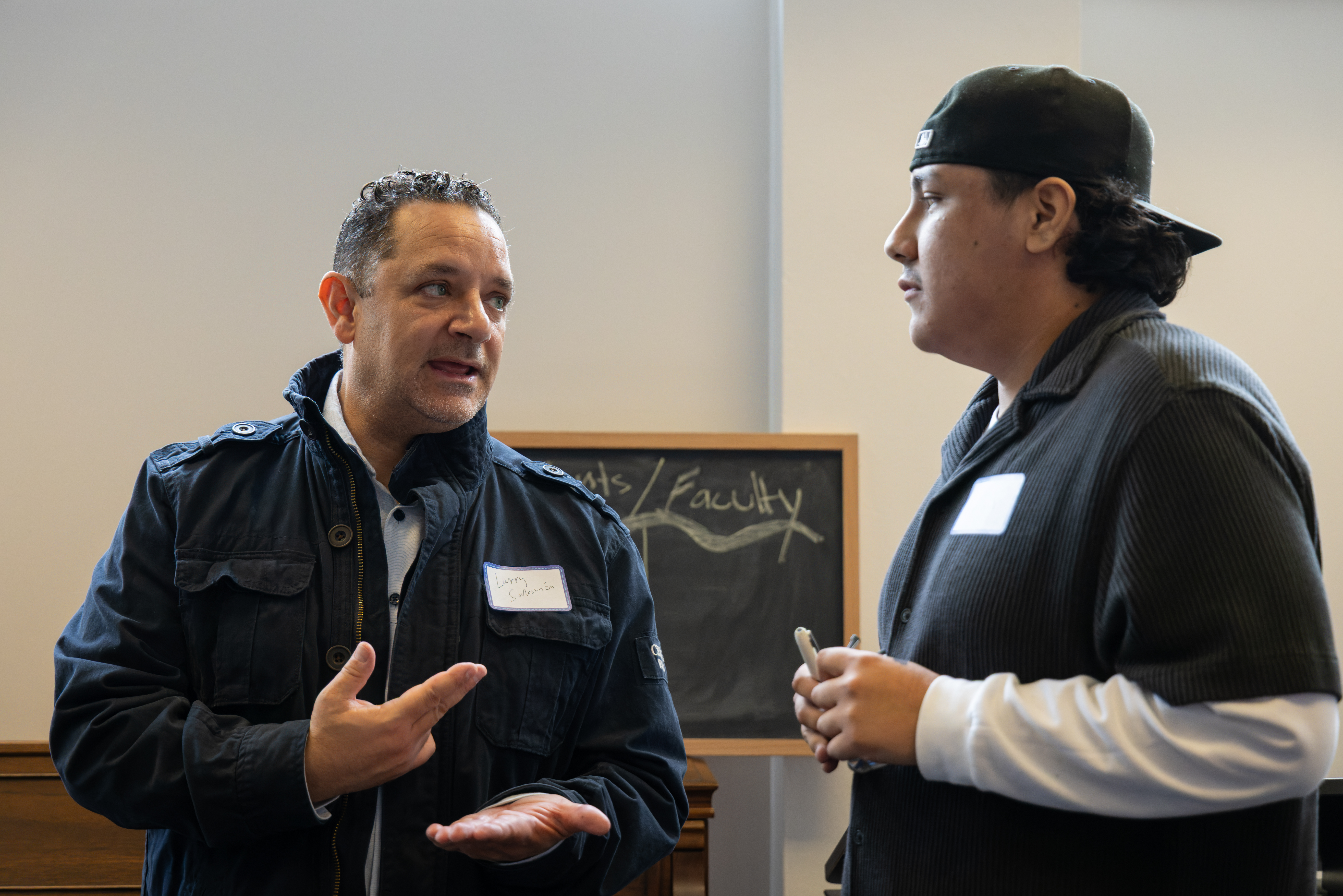 A faculty and a student in discussion.