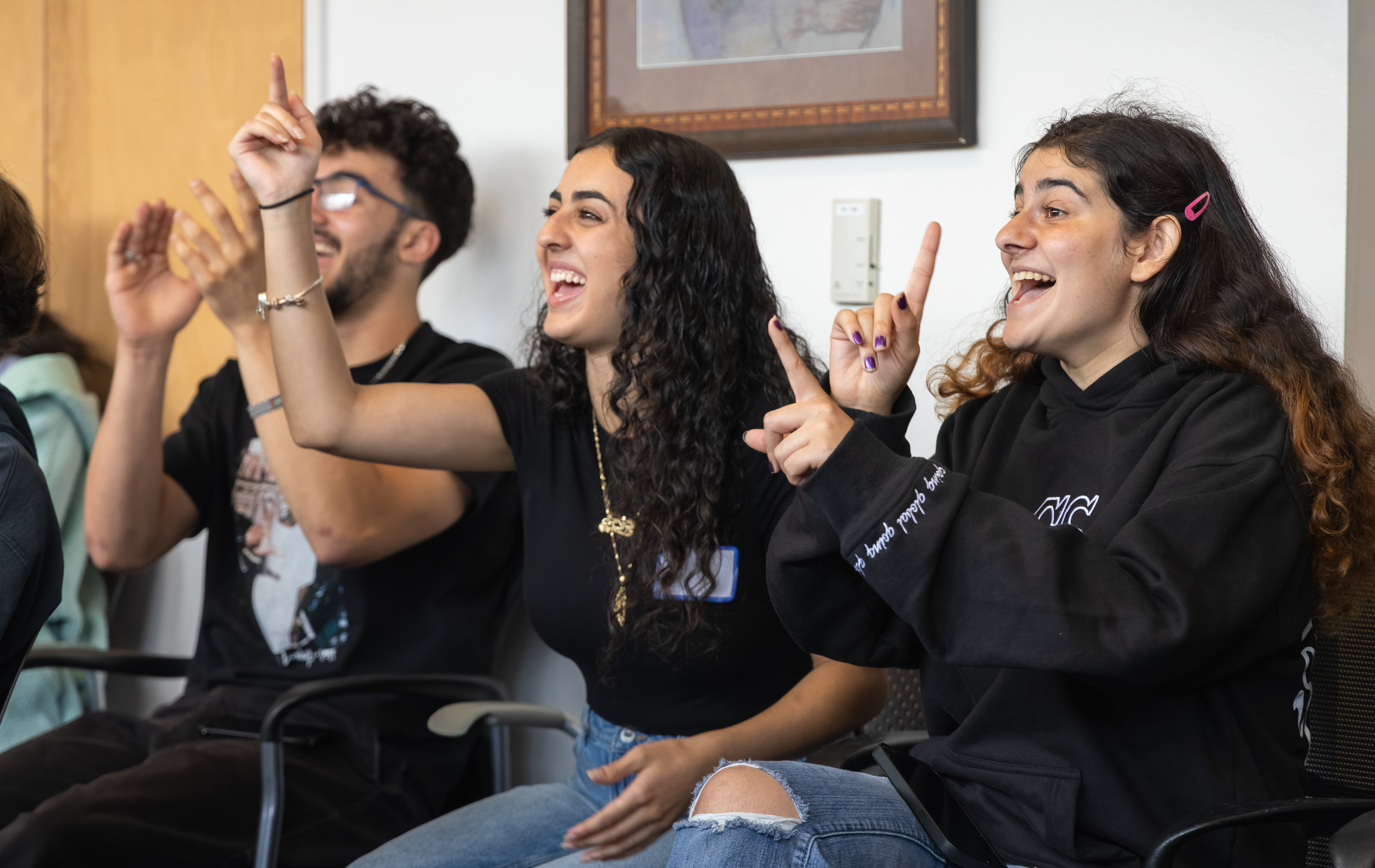 Two girls getting excited over trivia